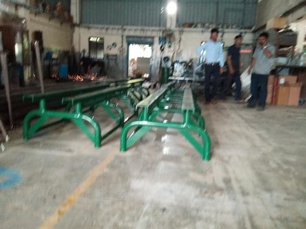 Green-painted missile handling tables built to naval drawings