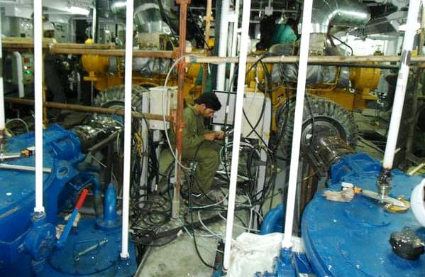 Installed marine machinery and pipework inside a ship's machinery space